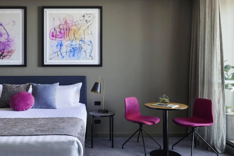 a guest room with art at The Chen Melbourne hotel accor