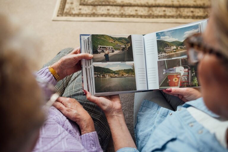 friends looking through photo album